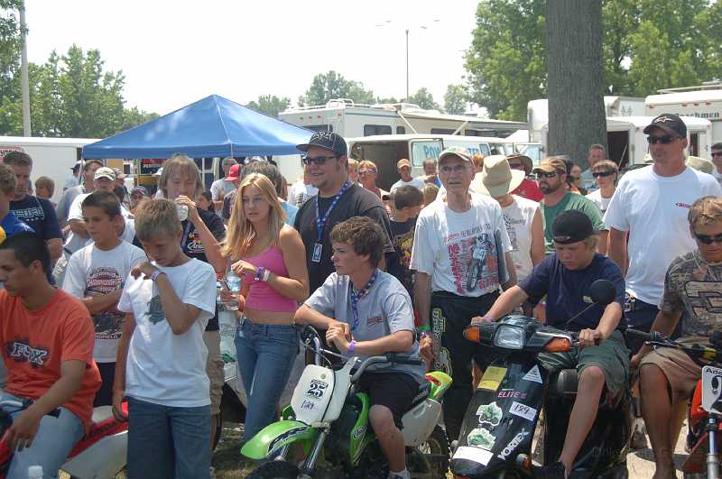 DuQuoin 2006 013.JPG - After our race program was completed, the AMA crowd assembled for instruction from their race organizers.  The kids spend a week here competing for the AMA Amateur National Championship.  Successful riders sometimes get a chance at a professional ride; Nicky Hayden, who came up through this program, is one who did.  The older gentleman at right-center is Steve Boggs; he won the AHRMA Super Senior class race today (I took a third behind him & Melvin Brown).